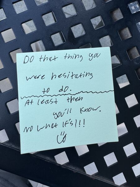 Handwritten sticky note with words of encouragement